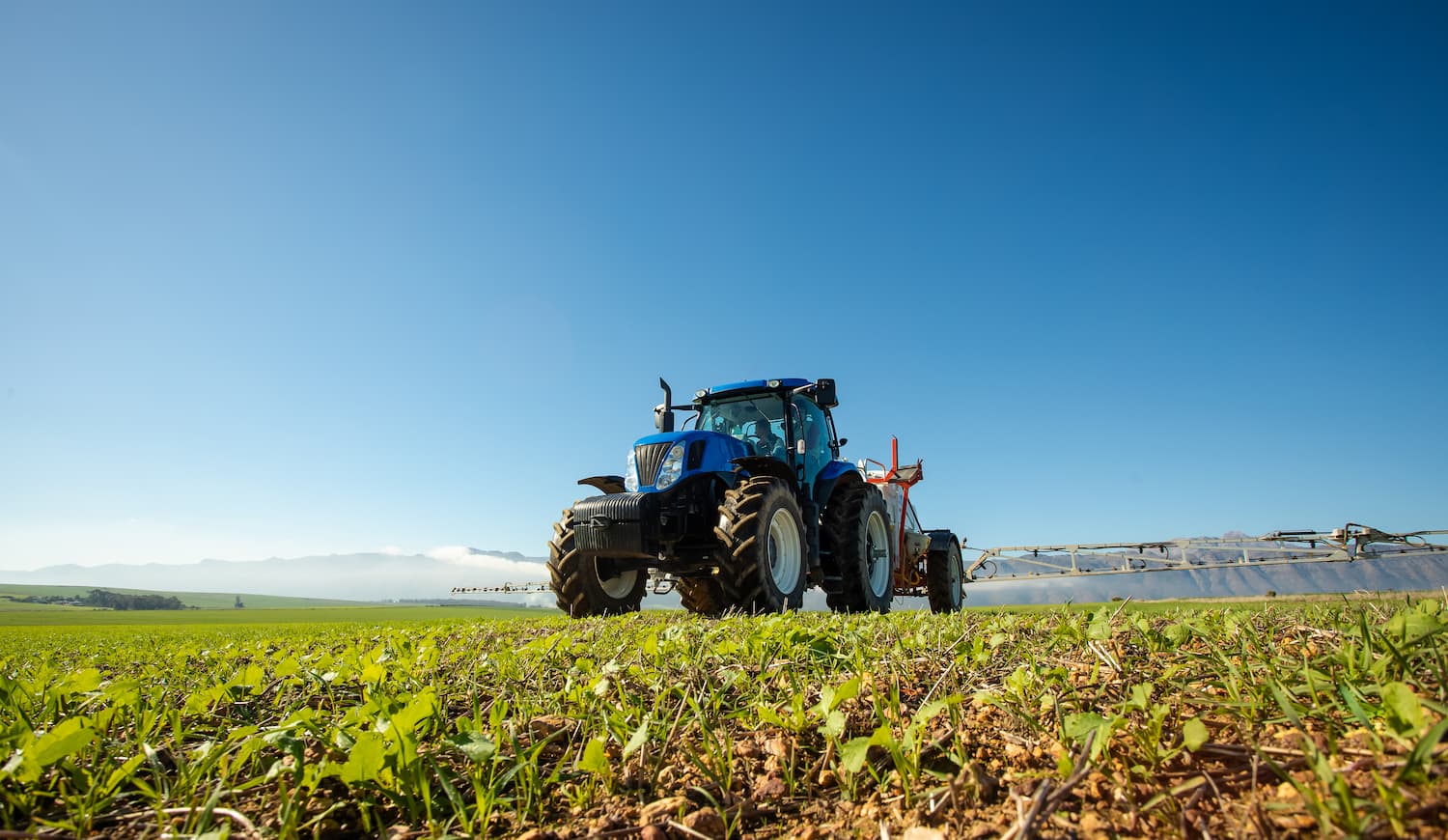 Tractor Spraying a field
